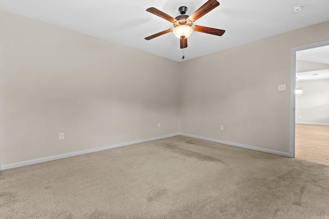 carpeted empty room with ceiling fan