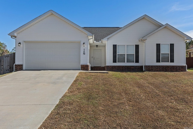 ranch-style house featuring a garage and a front lawn