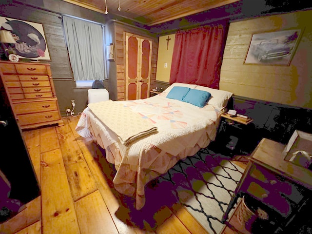 bedroom with wooden walls