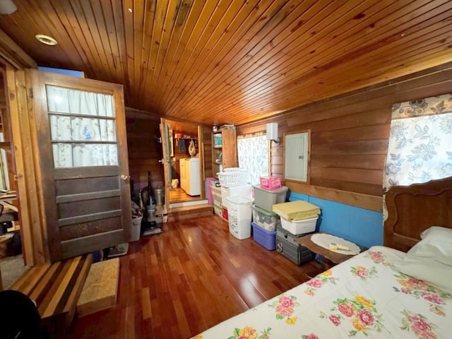 bedroom featuring electric panel, wooden ceiling, dark wood-type flooring, and wood walls