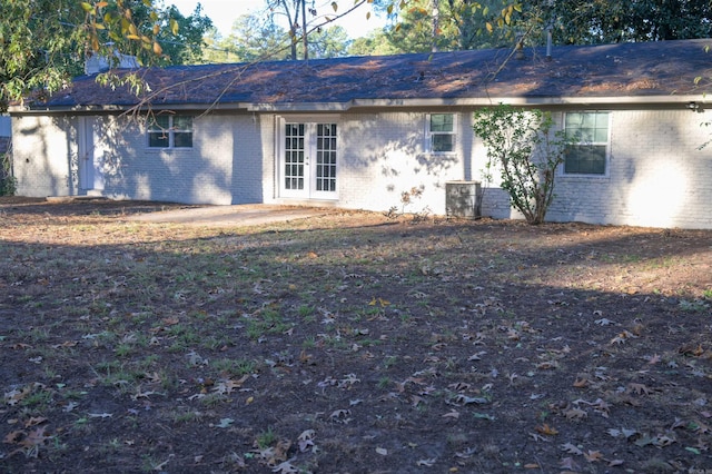 rear view of house featuring french doors