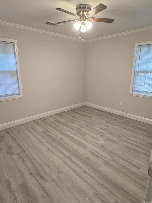 unfurnished room featuring ceiling fan, light hardwood / wood-style floors, and crown molding