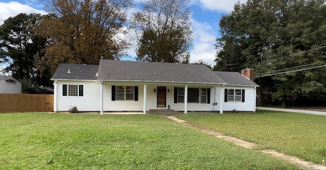 view of front of house with a front lawn and a porch