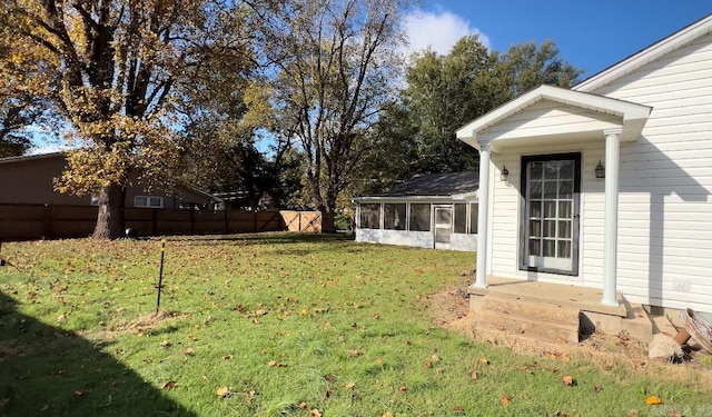 view of yard with a sunroom