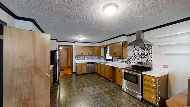 kitchen featuring decorative backsplash, appliances with stainless steel finishes, crown molding, and wall chimney exhaust hood