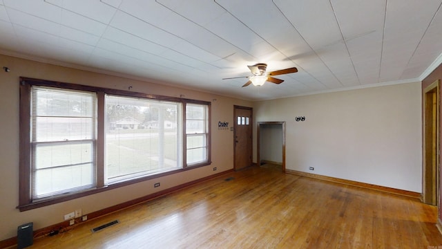 spare room featuring light hardwood / wood-style floors, ceiling fan, and ornamental molding