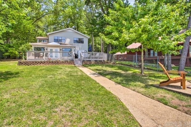 exterior space featuring a deck and a front yard