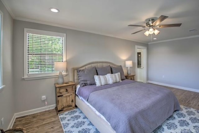 bedroom featuring light wood-type flooring, ceiling fan, and ornamental molding