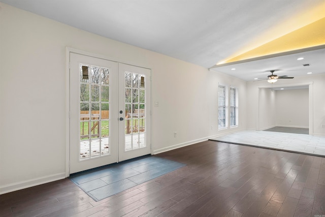 doorway to outside featuring plenty of natural light, lofted ceiling, dark wood-type flooring, and french doors