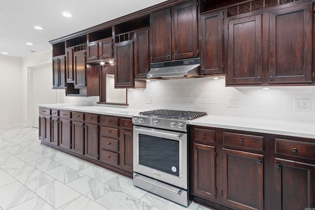 kitchen featuring gas stove, dark brown cabinetry, and tasteful backsplash