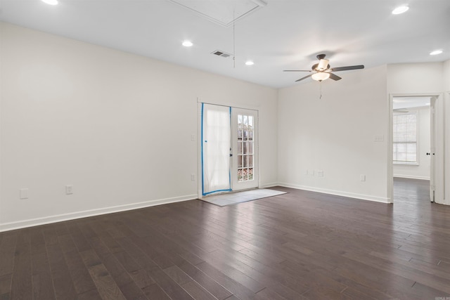 unfurnished room with ceiling fan and dark wood-type flooring