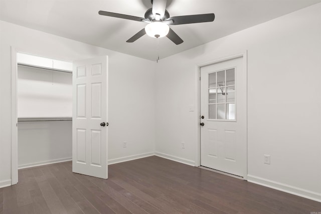 empty room featuring ceiling fan and dark hardwood / wood-style floors