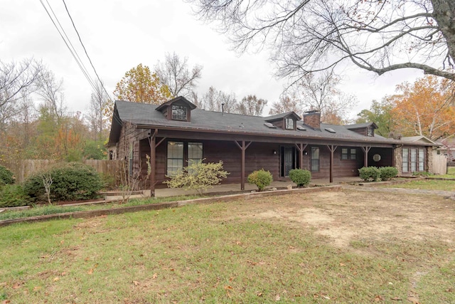 back of house featuring a yard