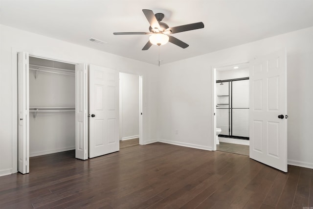 unfurnished bedroom with ensuite bath, ceiling fan, and dark hardwood / wood-style floors