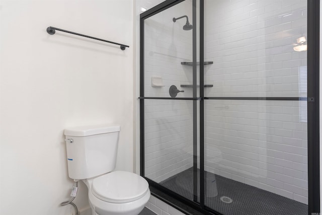 bathroom with toilet and walk in shower