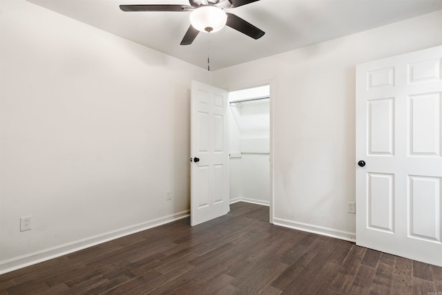 unfurnished bedroom featuring dark hardwood / wood-style flooring, a closet, and ceiling fan