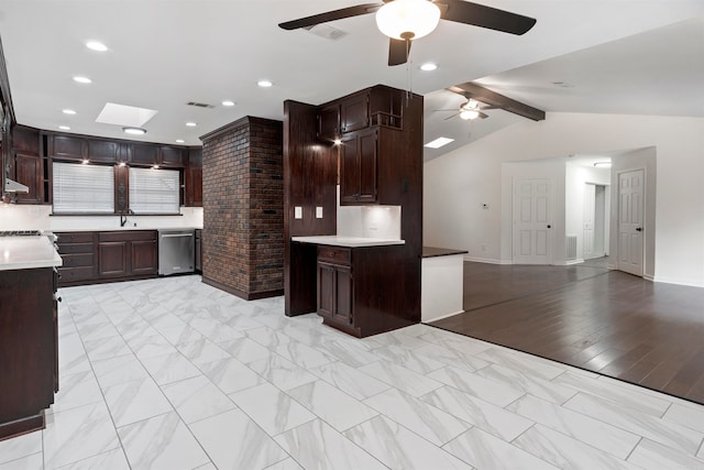 kitchen featuring dark brown cabinetry, dishwasher, sink, light hardwood / wood-style flooring, and vaulted ceiling with skylight