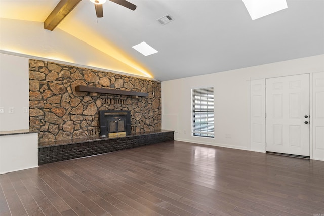 unfurnished living room featuring beamed ceiling, dark hardwood / wood-style floors, high vaulted ceiling, and ceiling fan