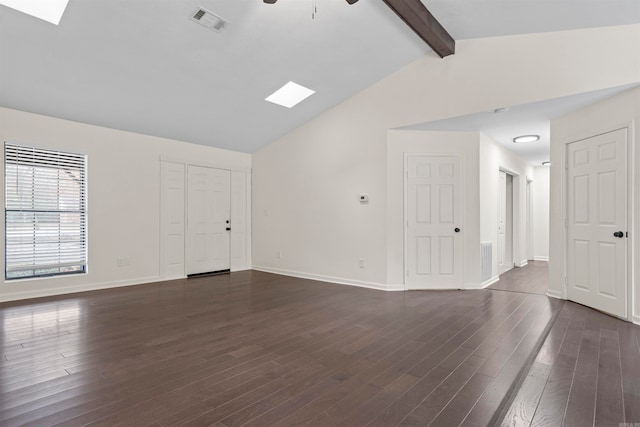 spare room featuring vaulted ceiling with beams, dark hardwood / wood-style flooring, and ceiling fan