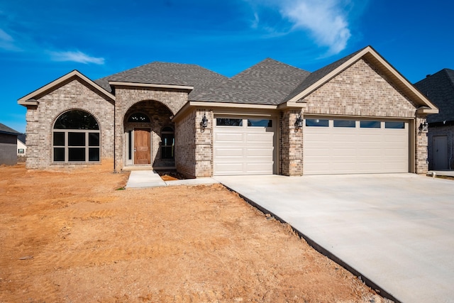 view of front of property with a garage