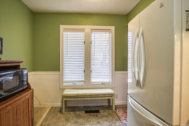 interior space featuring a textured ceiling