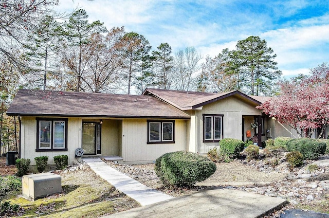 ranch-style house featuring central AC unit