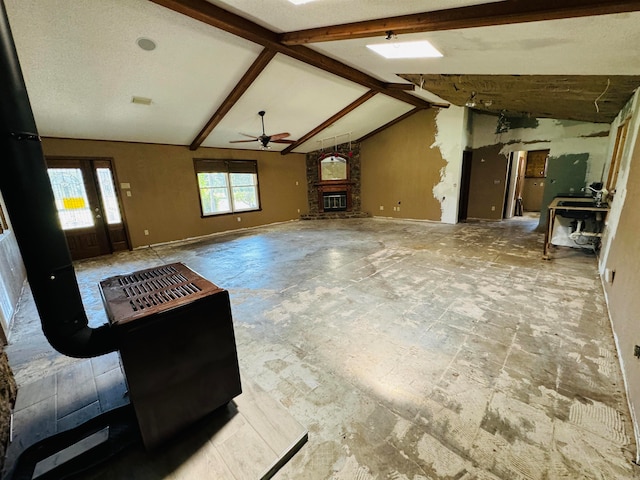 living room featuring lofted ceiling with beams and ceiling fan