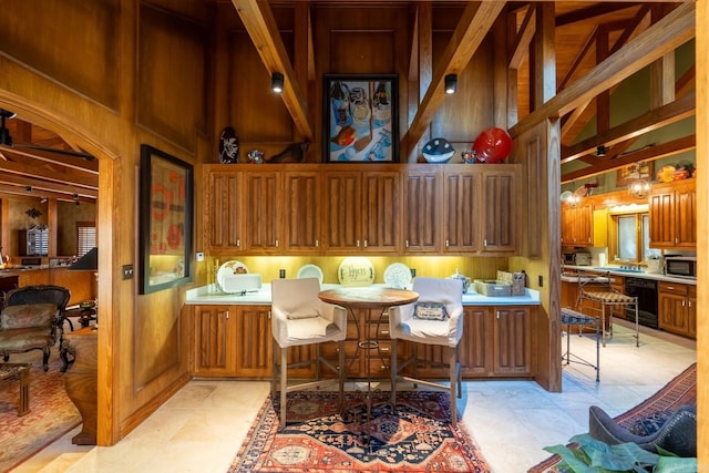 tiled office with high vaulted ceiling, beam ceiling, and beverage cooler