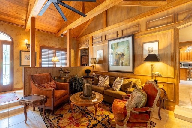 sitting room with wood ceiling, wooden walls, beam ceiling, high vaulted ceiling, and light tile patterned flooring