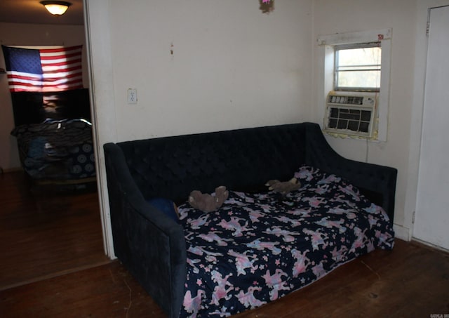 bedroom featuring dark hardwood / wood-style flooring and cooling unit