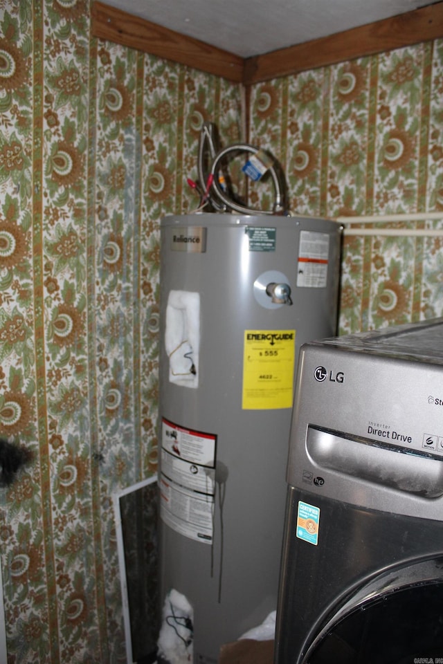 utility room featuring washer / dryer and water heater