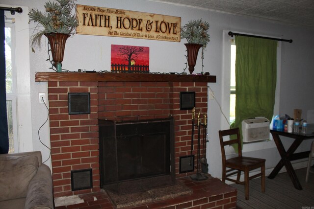 living room with a brick fireplace