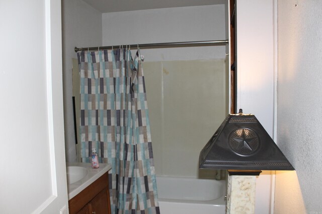 bathroom with vanity and shower / tub combo