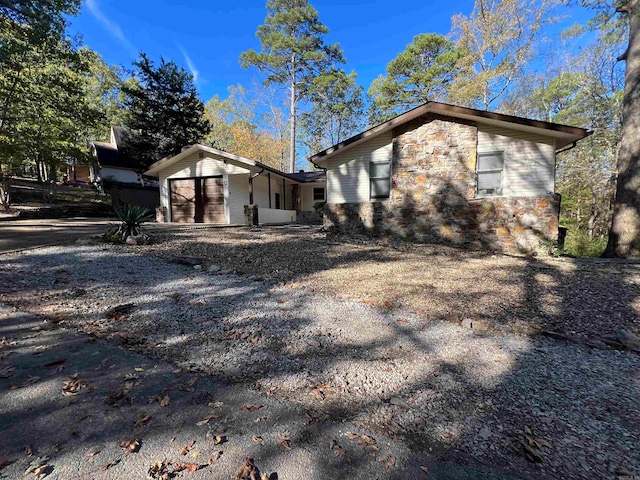 view of side of home featuring a garage