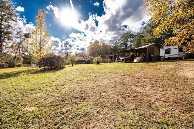 view of yard with a carport