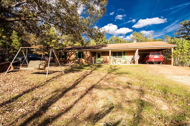 single story home featuring a front lawn and a carport