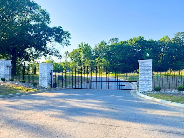 view of gate featuring fence