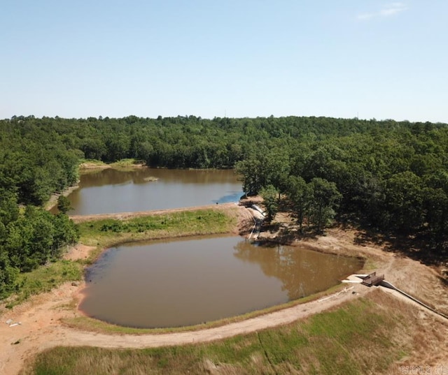 view of water feature with a view of trees