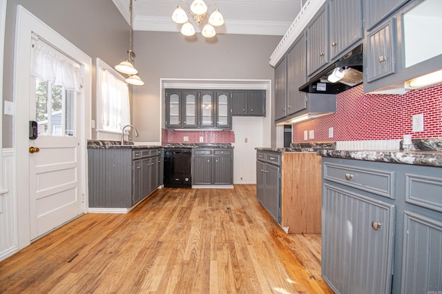 kitchen featuring gray cabinets, dishwasher, decorative light fixtures, and light hardwood / wood-style flooring