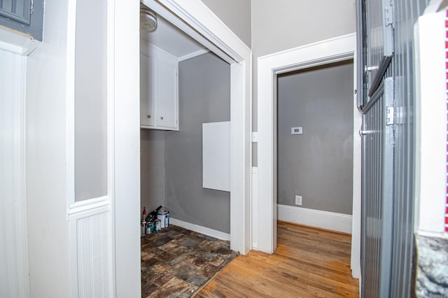 laundry room featuring wood-type flooring