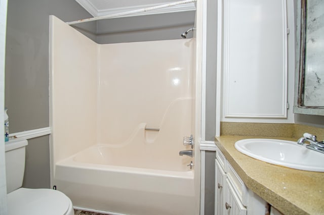 full bathroom featuring vanity, toilet,  shower combination, and crown molding