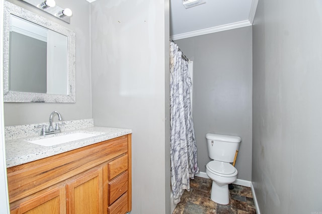 bathroom featuring vanity, toilet, and ornamental molding