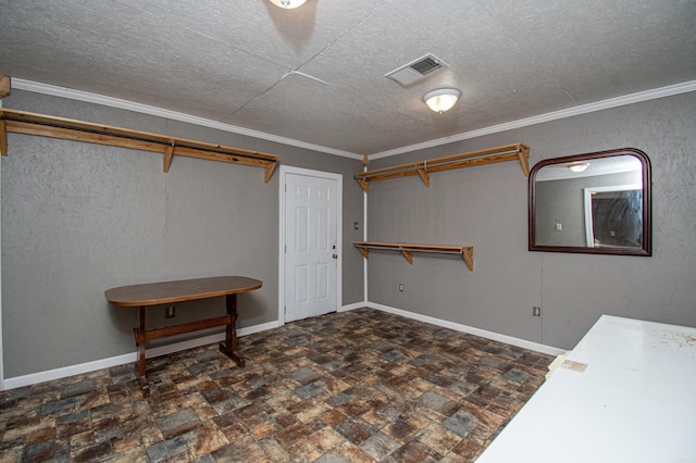 interior space with a textured ceiling and ornamental molding