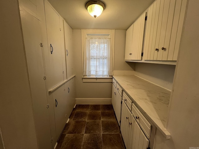 1905 Bethesda, Mena, AR 71953 - kitchen featuring white cabinetry and baseboards