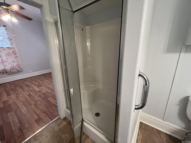 1905 Bethesda, Mena, AR 71953 - full bathroom with a ceiling fan, a shower stall, and baseboards