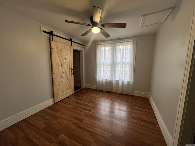 1905 Bethesda, Mena, AR 71953 - unfurnished bedroom featuring attic access, dark wood finished floors, and baseboards