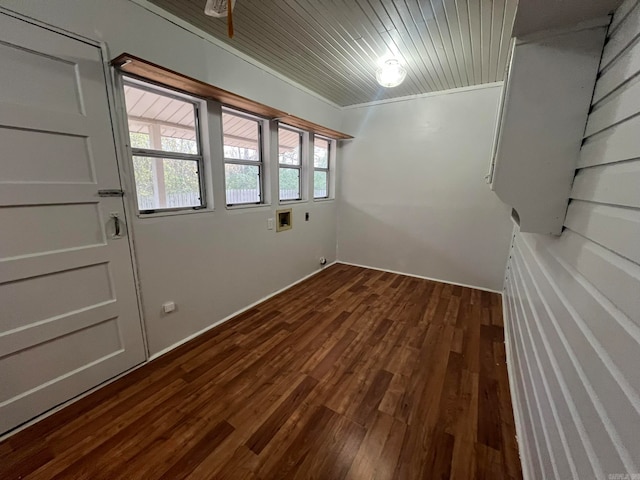 spare room featuring wood ceiling and dark wood-style flooring