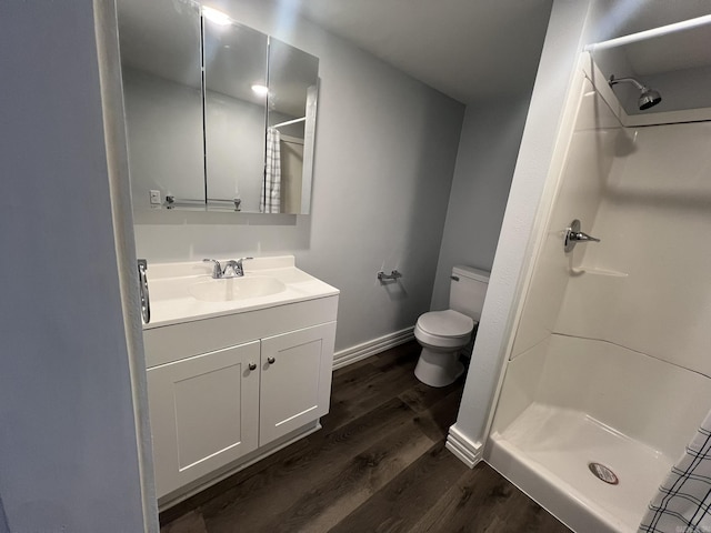 1905 Bethesda, Mena, AR 71953 - full bathroom with wood finished floors, vanity, a shower, and toilet