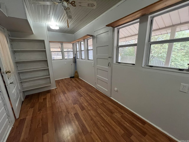 interior space with dark wood-style floors and ceiling fan