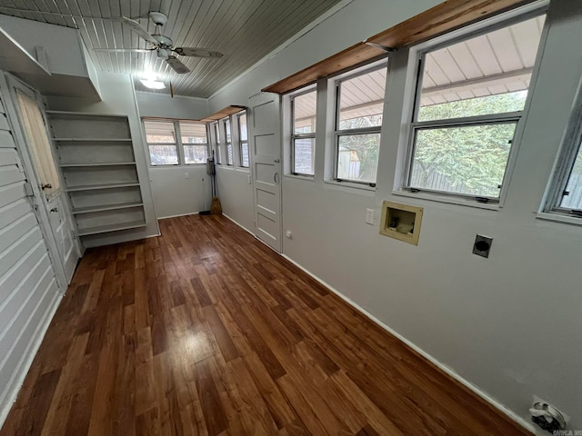 interior space with ceiling fan and dark wood-style flooring